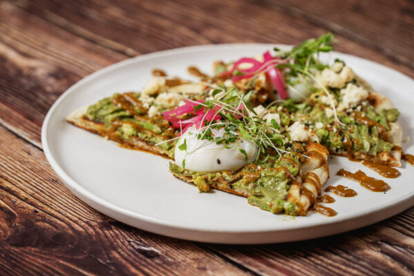 Best Louisville Breakfast - Steel Paneer Bhuri Avocado Toast - Garlic Chili Naan Smashed Avocado. Local Paneer Cheese, Curry Sauce, Pickled Red Onions, Cage Free Poached Egg