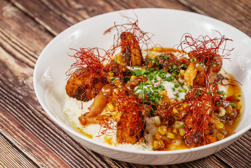 Louisville's Best Breakfast - Shrimp & Grits - White Cheddar & Mascarpone Wesienberg Grits, Seared Shrimp, Poached Egg, Charred Corn, Bacon & Bourbon sauce, Chill Crunch