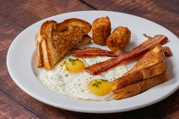 Louisville's Best Breakfast - American Breakfast - 2 cage Free Eggs Cooked Your Way, Choice Of Meat (Bacon, Sausage, Vegan Sausage) Choice of Bread (Whole Grain, Brioche, Croissant) Hashbrown Kegs
