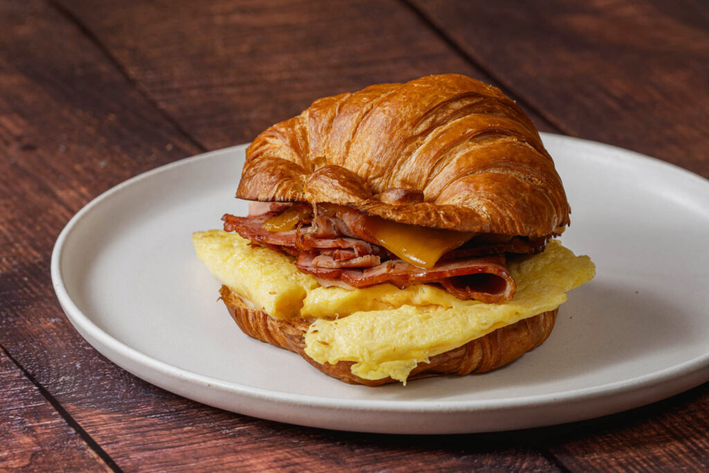 Louisville's Best Breakfast - BourbonRidge Uncured Smoked Ham Croissant - BourbonRidge Uncured Smoked Ham, Folded Egg, Tillamook Cheddar, Maple Aioli, Croissant